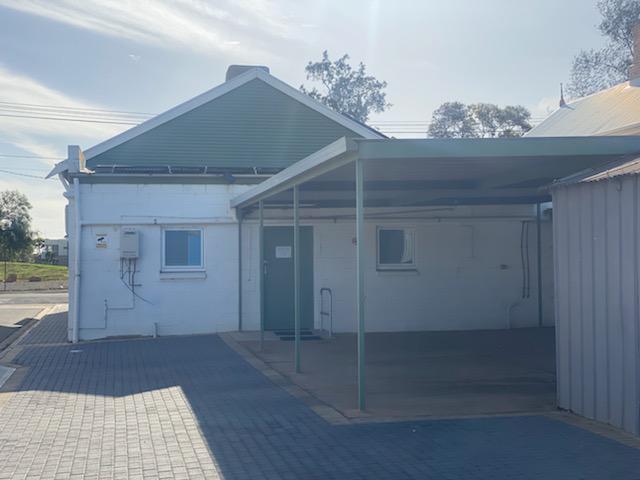 Side entrance and carport